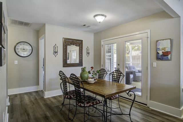 dining area with visible vents, baseboards, dark wood-style floors, and french doors