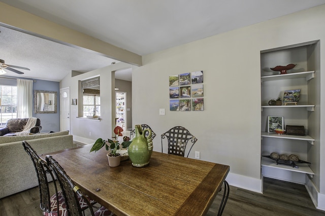 dining area with ceiling fan, baseboards, and dark wood finished floors