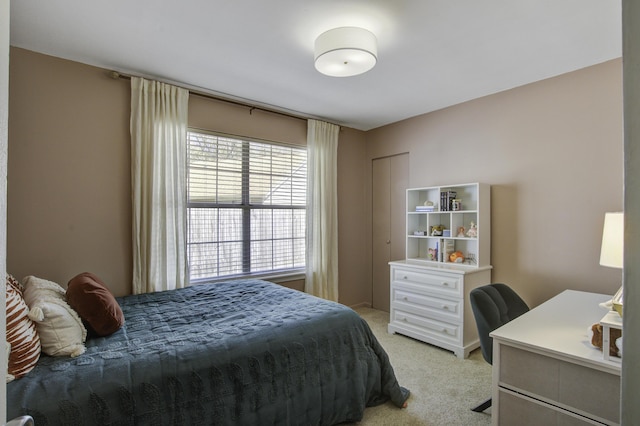 bedroom featuring light colored carpet