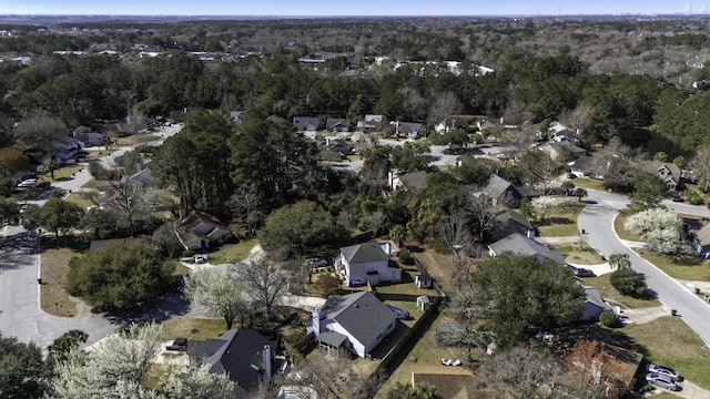 aerial view featuring a residential view and a wooded view