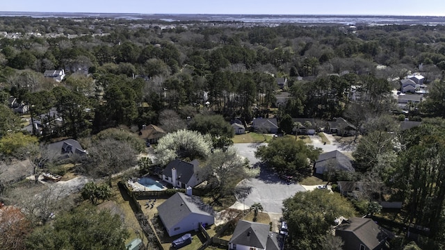 bird's eye view featuring a forest view and a residential view