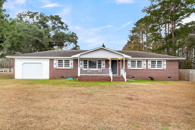 single story home featuring a front yard, a porch, and a garage