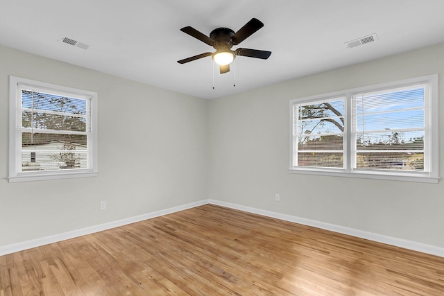 empty room featuring ceiling fan and light wood-type flooring