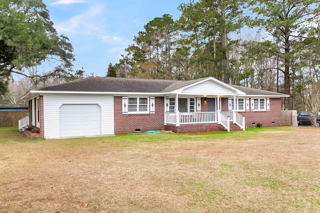 ranch-style house with a porch, a garage, and a front lawn