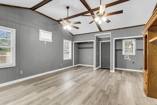 unfurnished bedroom with vaulted ceiling with beams, ceiling fan, and light wood-type flooring