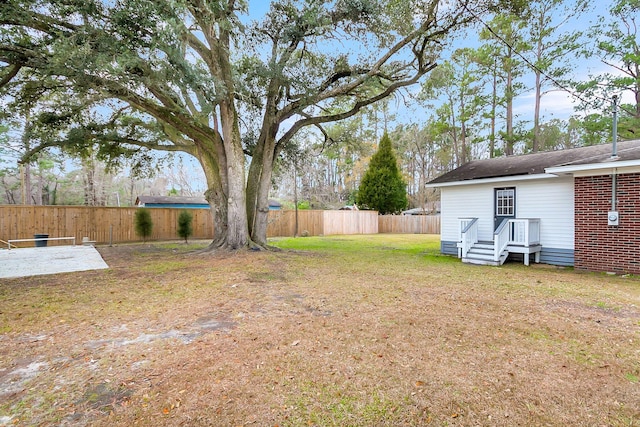 view of yard with a wooden deck