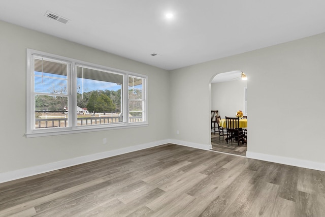 unfurnished room featuring light hardwood / wood-style floors