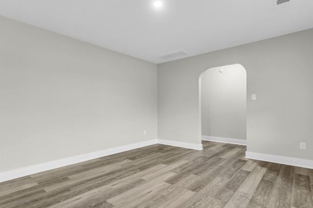 spare room featuring light wood-type flooring