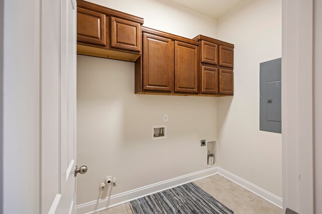 washroom with hookup for a washing machine, gas dryer hookup, electric panel, hookup for an electric dryer, and cabinets