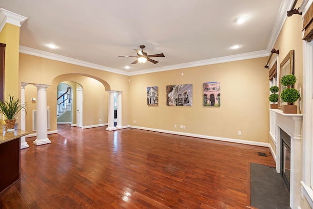 living room with decorative columns, ornamental molding, dark hardwood / wood-style flooring, and ceiling fan