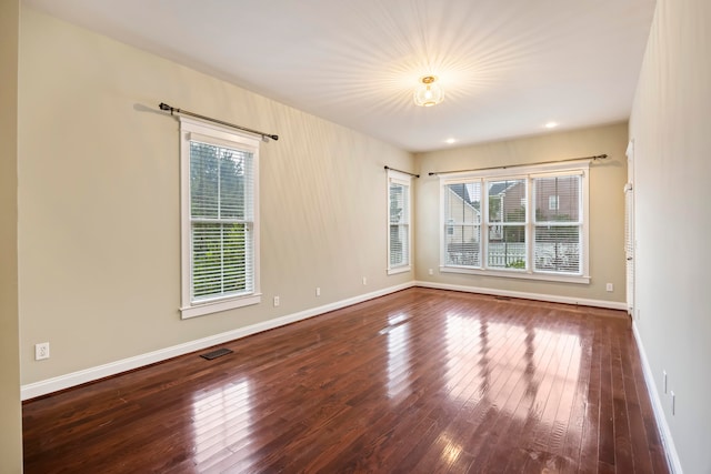 empty room with wood-type flooring