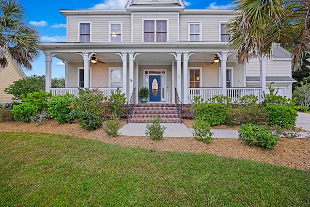 view of front facade with a front lawn and a porch