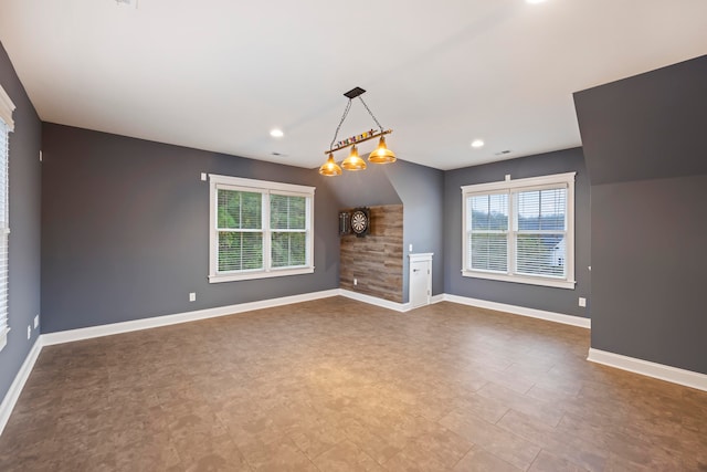 unfurnished living room with a notable chandelier