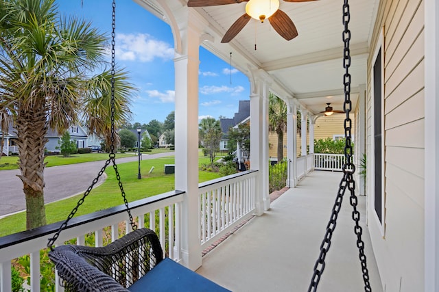 sunroom with ceiling fan and a wealth of natural light