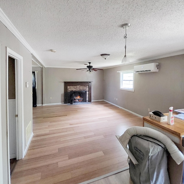 1201 Crescent St, Summerton, SC 29148 - living room with a textured ceiling, a fireplace, crown molding, light wood-style floors, and a wall unit AC