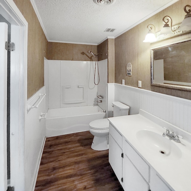 1201 Crescent St, Summerton, SC 29148 - full bathroom featuring a textured ceiling, wood finished floors, vanity, crown molding, and shower / washtub combination