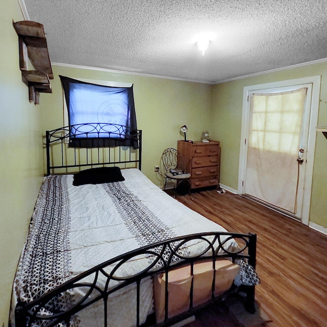 1201 Crescent St, Summerton, SC 29148 - bedroom with a textured ceiling, wood finished floors, and crown molding