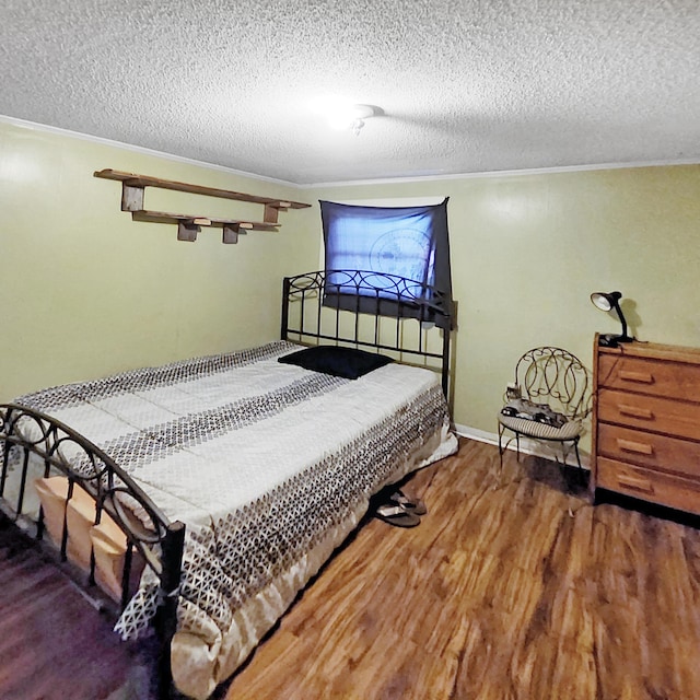 1201 Crescent St, Summerton, SC 29148 - bedroom featuring wood finished floors and a textured ceiling