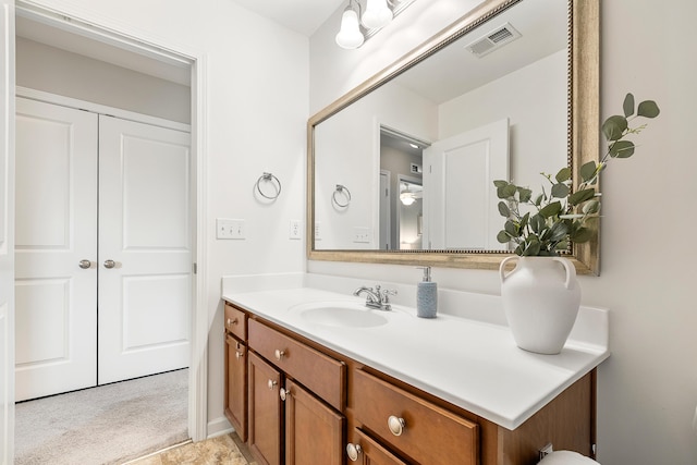 bathroom with visible vents and vanity