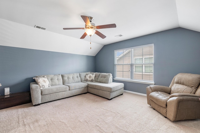 living room with vaulted ceiling, light colored carpet, and visible vents