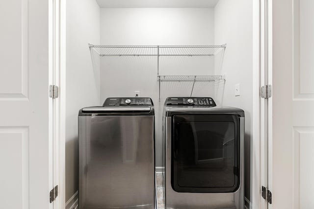 laundry area featuring laundry area and washer and clothes dryer