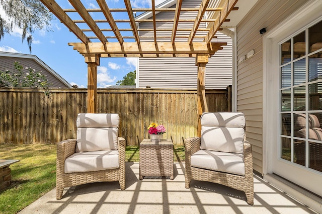view of patio / terrace with a pergola and fence