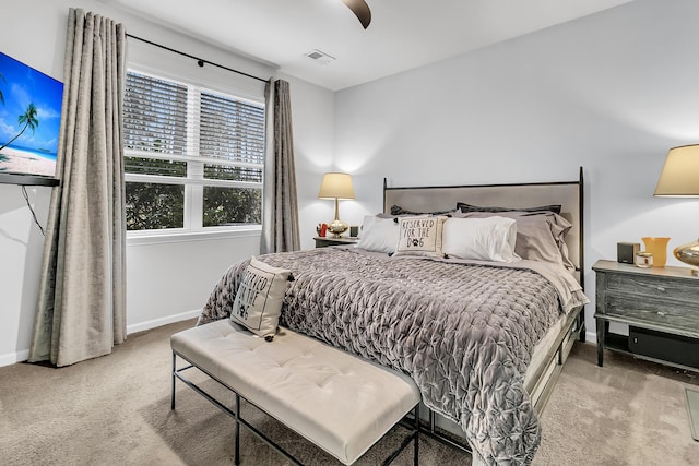 bedroom with light colored carpet and ceiling fan