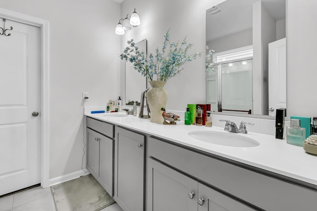 bathroom with vanity and tile patterned floors