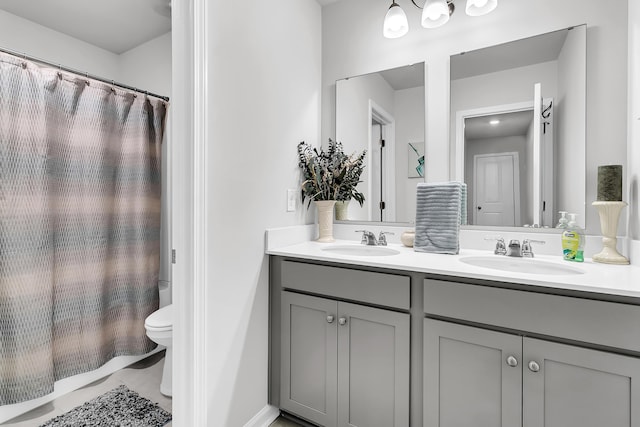 bathroom with vanity and toilet