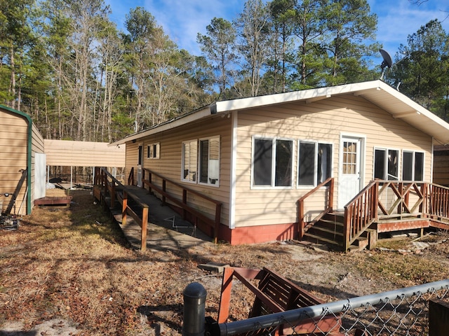 view of front facade with a carport