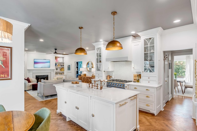 kitchen featuring light countertops, pendant lighting, a ceiling fan, and recessed lighting