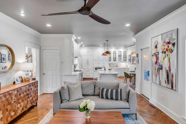 living area with crown molding, a ceiling fan, recessed lighting, and visible vents