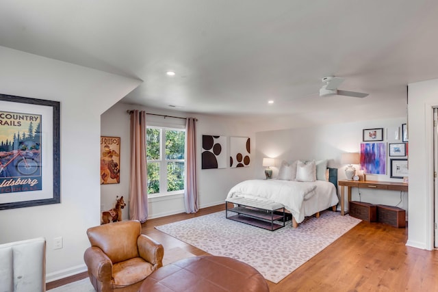 bedroom with recessed lighting, baseboards, and light wood finished floors