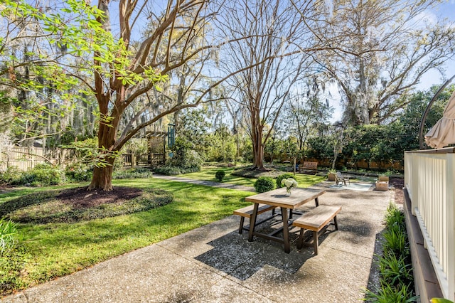 view of patio featuring fence and outdoor dining area