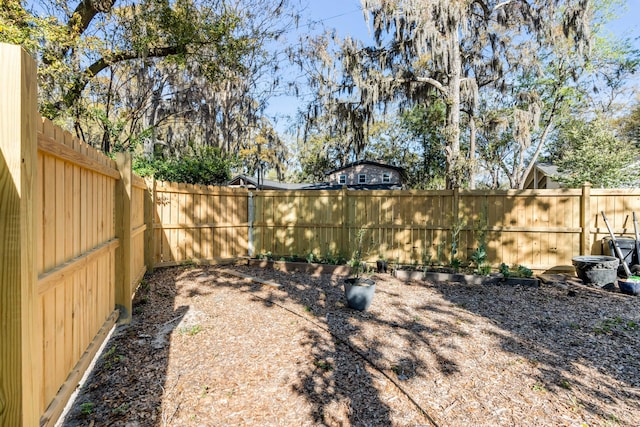 view of yard with a fenced backyard