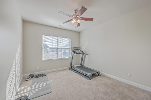 workout area featuring carpet floors, baseboards, visible vents, and ceiling fan