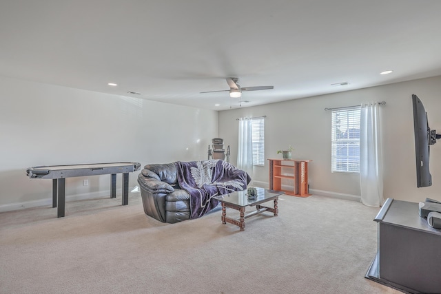 living area with recessed lighting, light colored carpet, a ceiling fan, baseboards, and visible vents