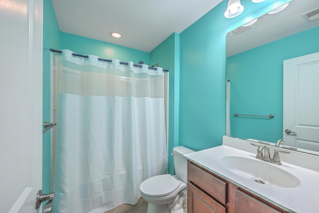 bathroom featuring a shower with curtain, visible vents, vanity, and toilet