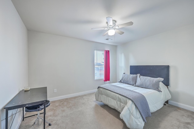 carpeted bedroom featuring baseboards, visible vents, and ceiling fan