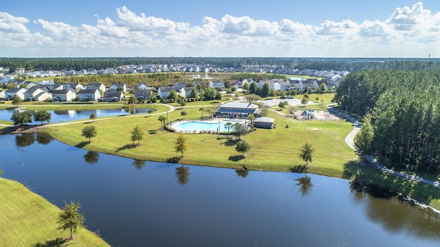 birds eye view of property featuring a water view and a residential view