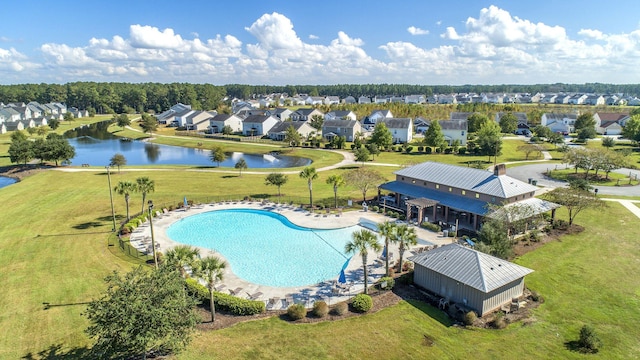 bird's eye view featuring a water view and a residential view