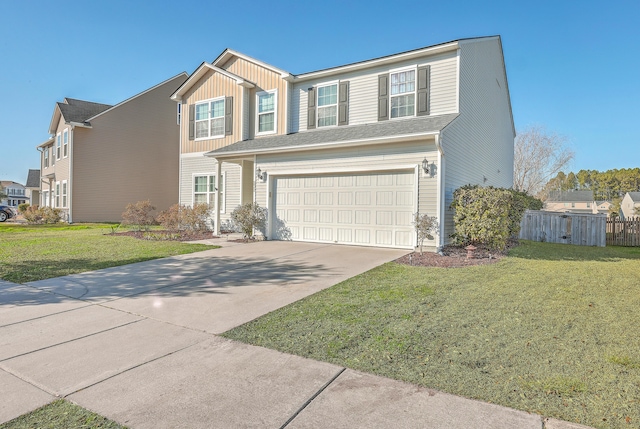 traditional home with an attached garage, concrete driveway, a front yard, and fence