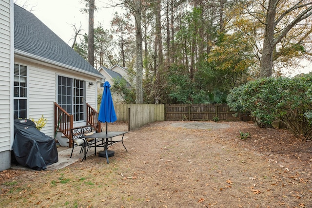 view of yard with a patio, fence private yard, and entry steps