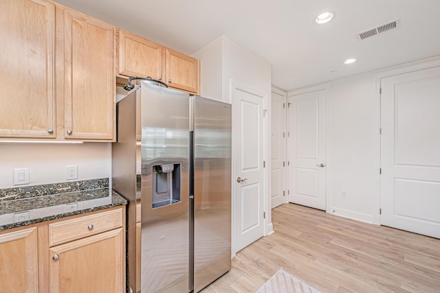 145 Pier View St Unit 214, Daniel Island, SC 29492 - kitchen with stainless steel fridge, light brown cabinetry, light wood-style floors, dark stone counters, and recessed lighting