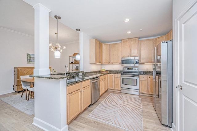 145 Pier View St Unit 214, Daniel Island, SC 29492 - kitchen featuring stainless steel appliances, light brown cabinets, decorative columns, crown molding, and a peninsula