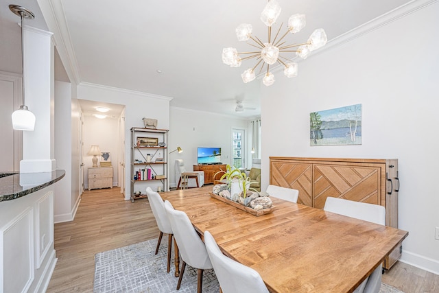 145 Pier View St Unit 214, Daniel Island, SC 29492 - dining area with a chandelier, light wood-style flooring, ornamental molding, and baseboards