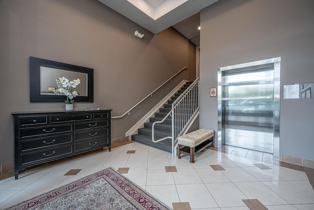 145 Pier View St Unit 214, Daniel Island, SC 29492 - stairway featuring a high ceiling, tile patterned flooring, baseboards, and elevator