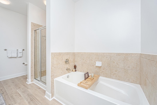 145 Pier View St Unit 214, Daniel Island, SC 29492 - full bathroom with a garden tub, a shower stall, and wood finished floors