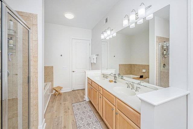 145 Pier View St Unit 214, Daniel Island, SC 29492 - full bath with a garden tub, a stall shower, double vanity, and wood finished floors