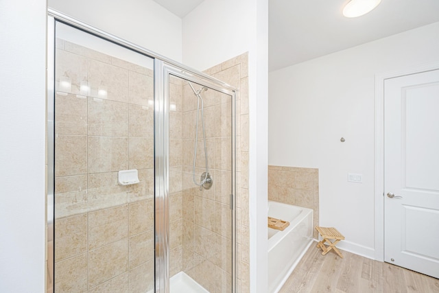 145 Pier View St Unit 214, Daniel Island, SC 29492 - bathroom with a bath, a shower stall, and wood finished floors